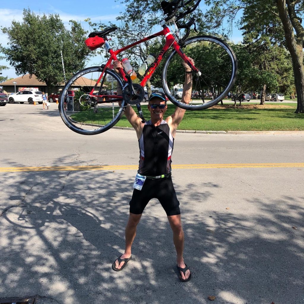 Celebratory pose at the 2019 Niagara Falls Barrelman 70.3