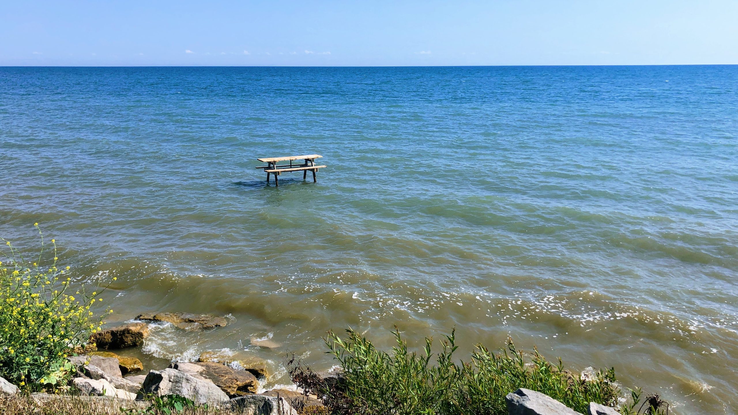 Picnic table in the water near Selkirk Provincial Park, along the Cannonball 300 bikepacking route.