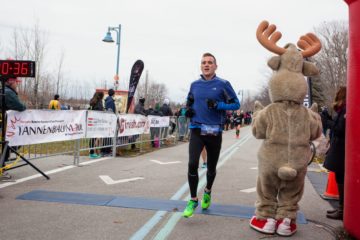 Crossing the finish line at the 2016 Tannenbaum 10k at the 40:36 mark, setting my 10k PB at 40:29