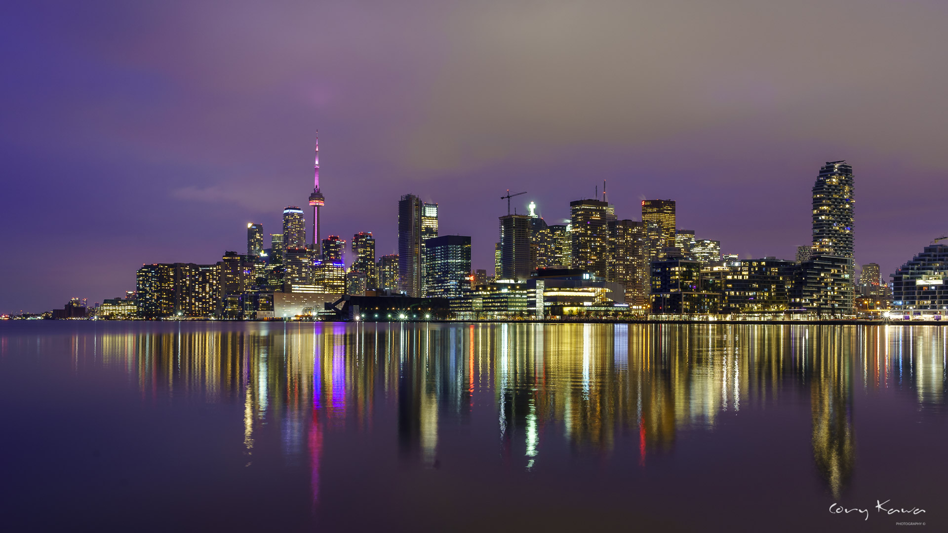 Toronto skyline reflecting out over lake Ontario